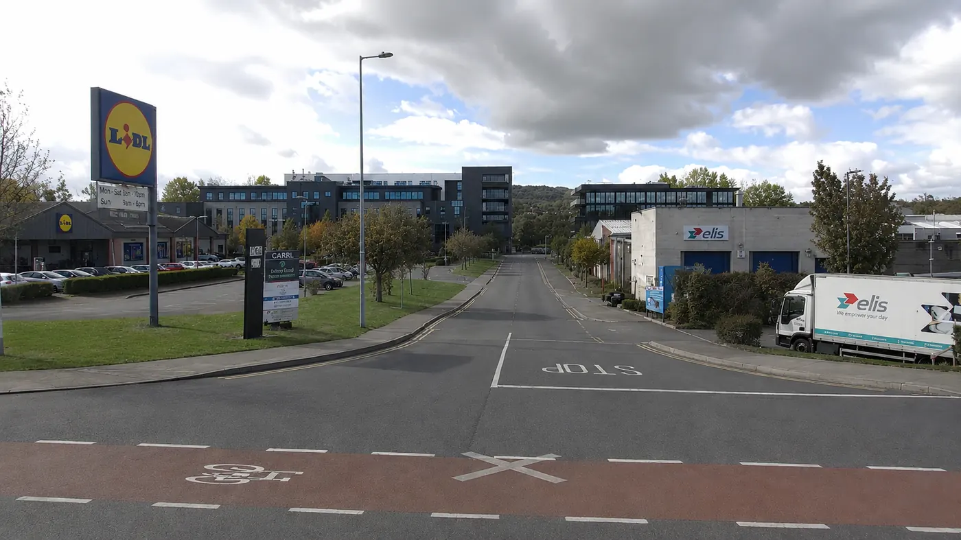 Entrance approach to the Dún Laoghaire driving test centre at Bakers Point, near Lidl and local commercial buildings